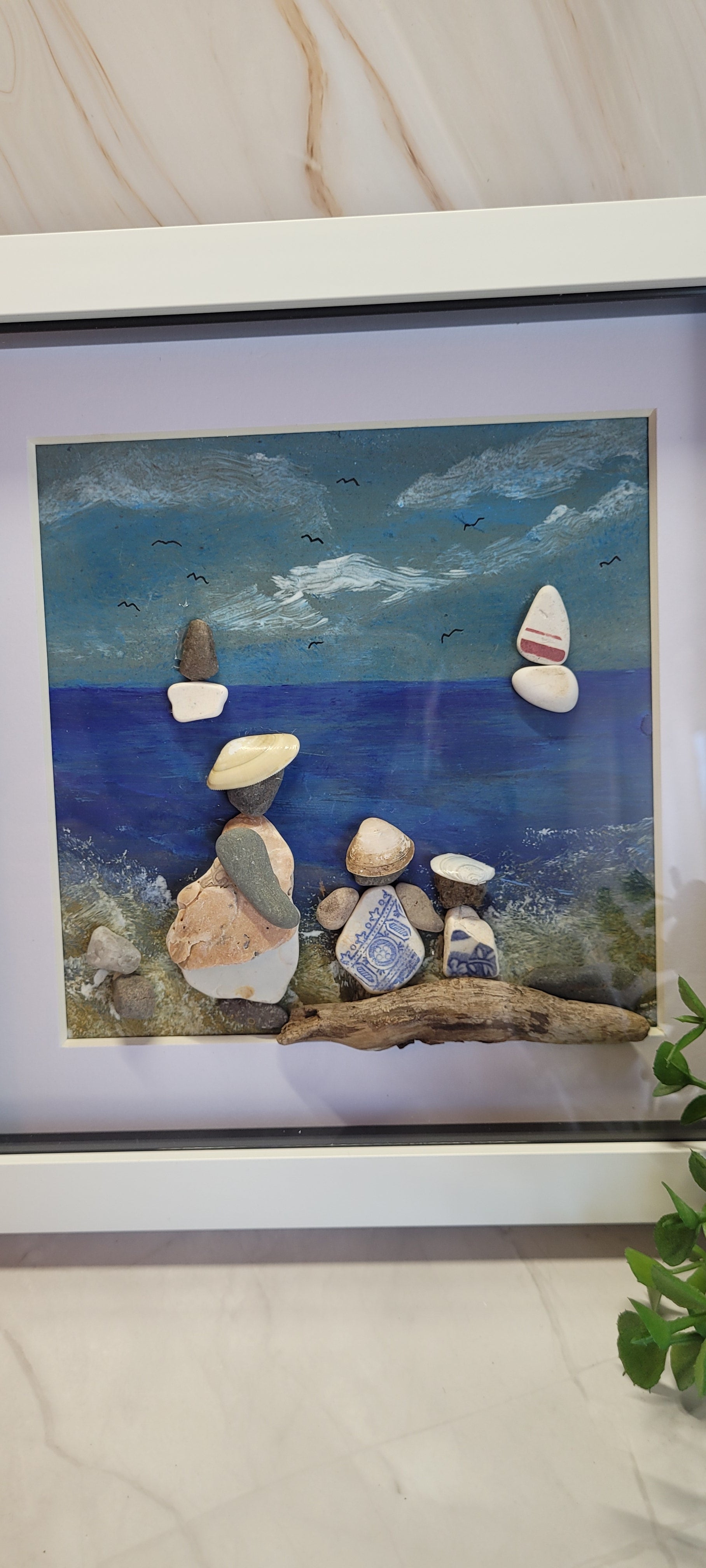 Hand painted pebble and shell framed picture