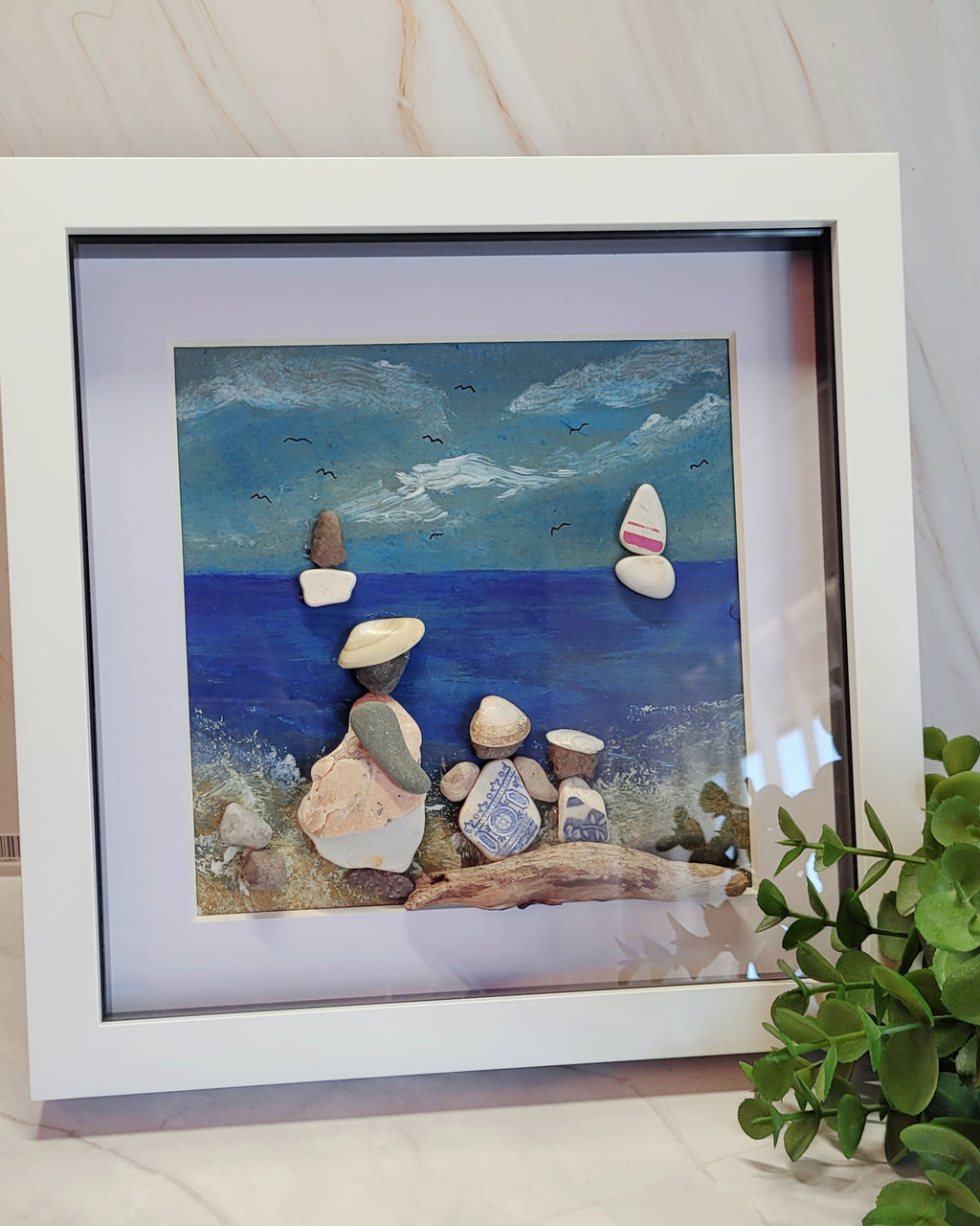 Hand painted pebble and shell framed picture